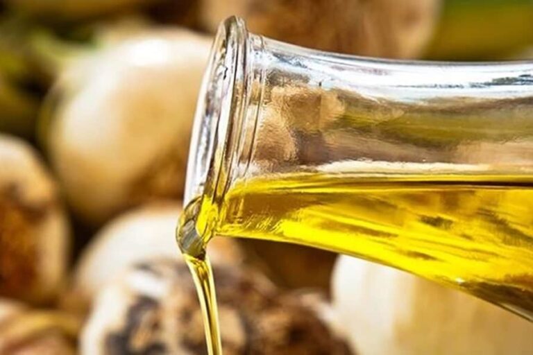 Garlic oil pouring out of a bottle