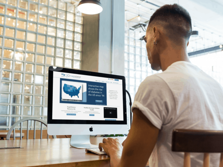 Man reading a computer looking for reliable gut health websites