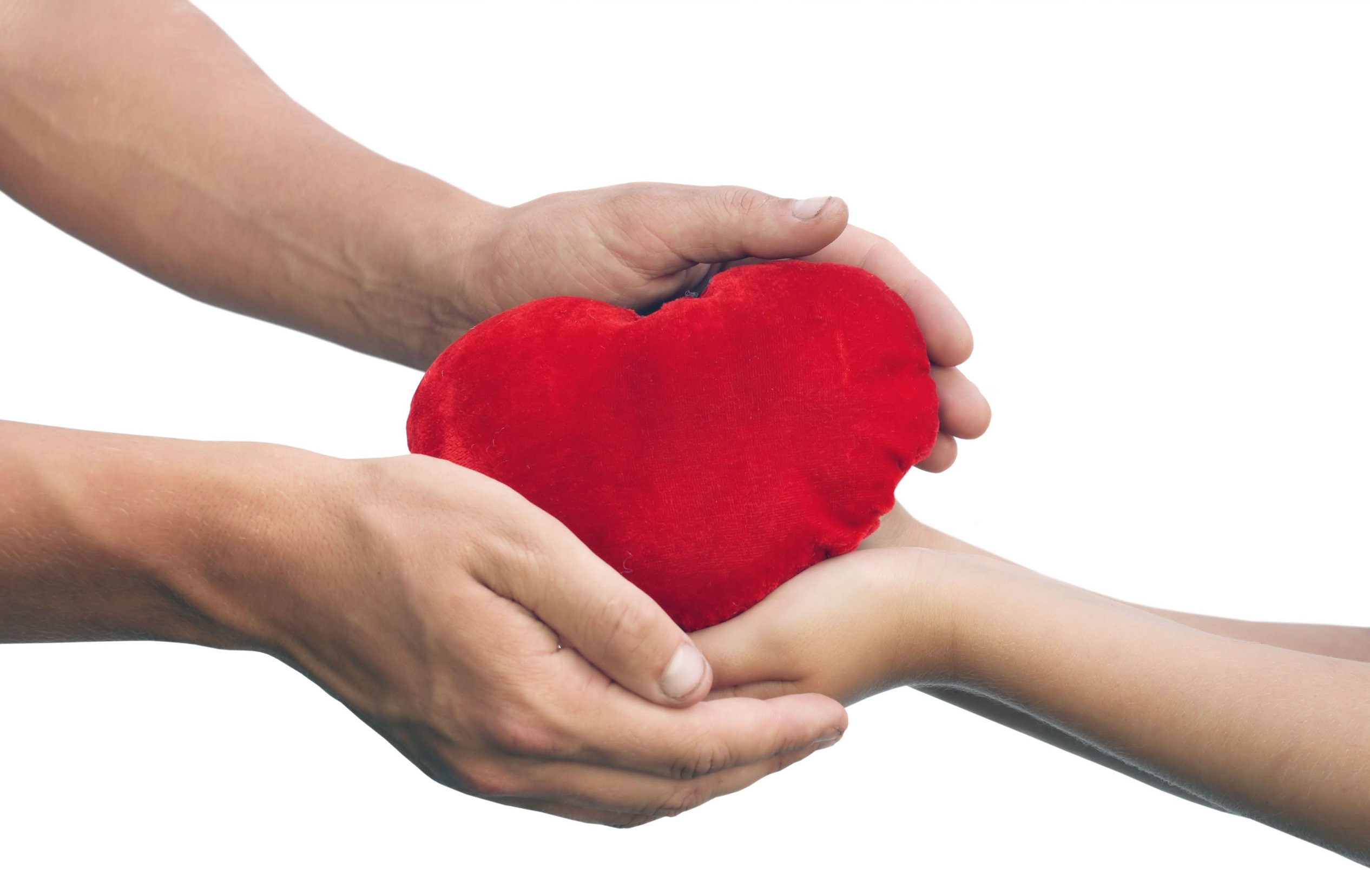 Hands holding a heart pillow- and idea for thoughtful gift ideas for friends and family, especially if you are looking for gluten free gift ideas or unique gift ideas