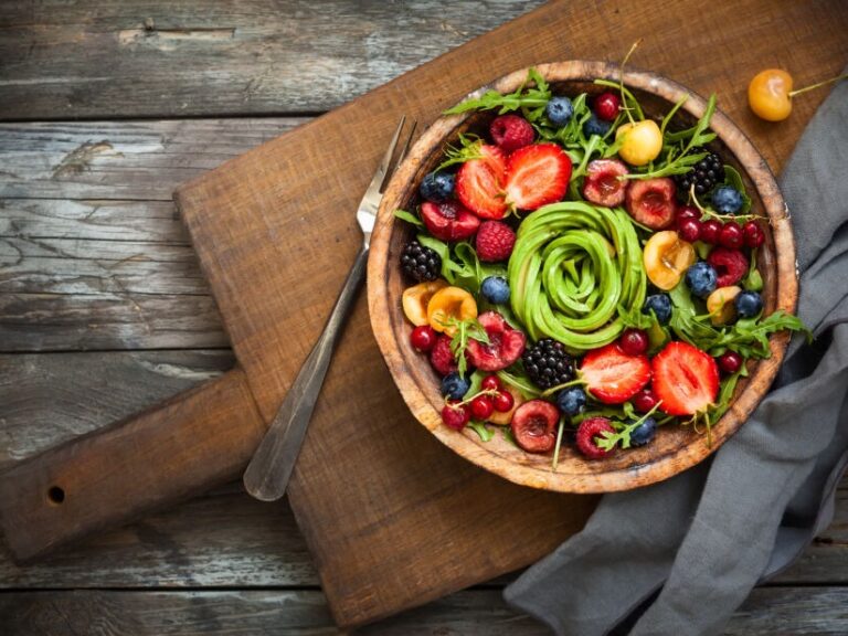 AIP diet autoimmune protocol diet includes foods like this image of a platter of fruits and green vegetables