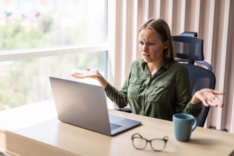 what is mild celiac disease, woman looking at computer looking very confusted at what she is looking at