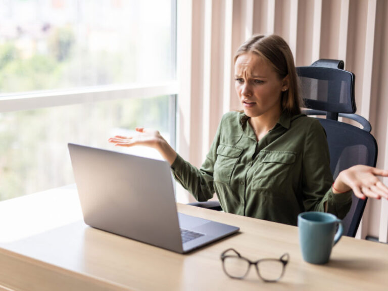 what is mild celiac disease, woman looking at computer looking very confusted at what she is looking at