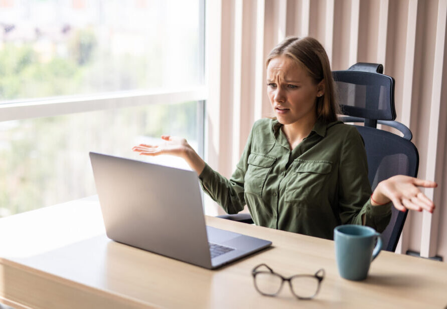 what is mild celiac disease, woman looking at computer looking very confusted at what she is looking at