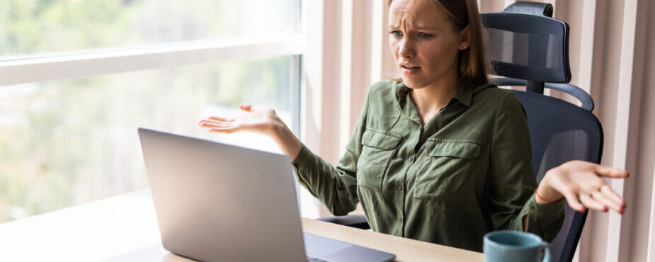 what is mild celiac disease, woman looking at computer looking very confusted at what she is looking at