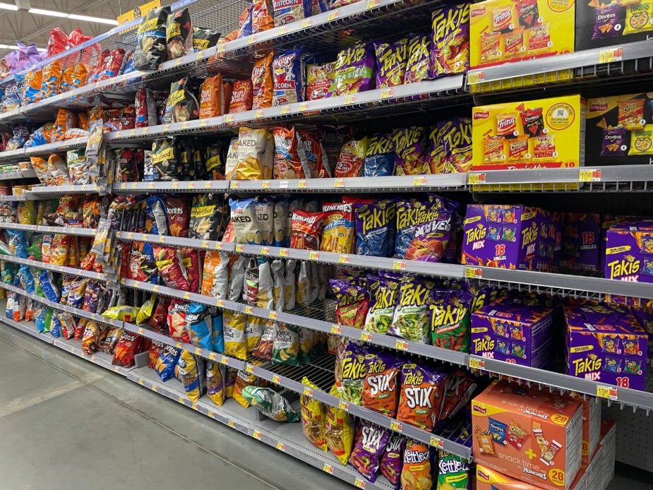 processed foods in a supermarket. Shelves and shelves of packaged foods